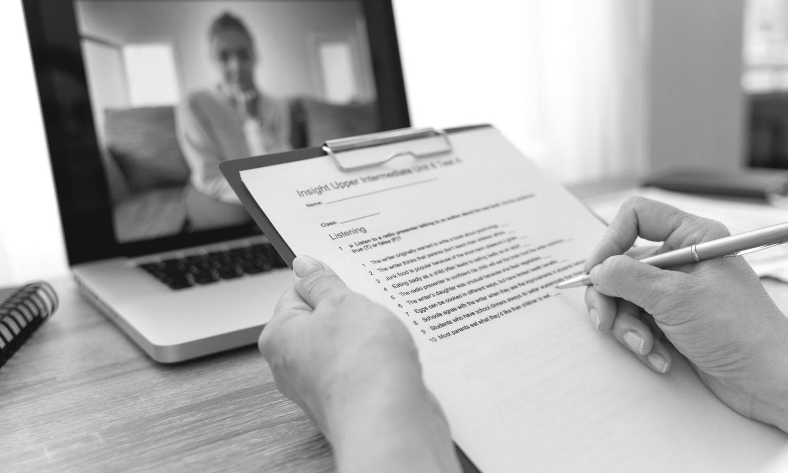 Business analysis workspace showing financial documents and planning materials